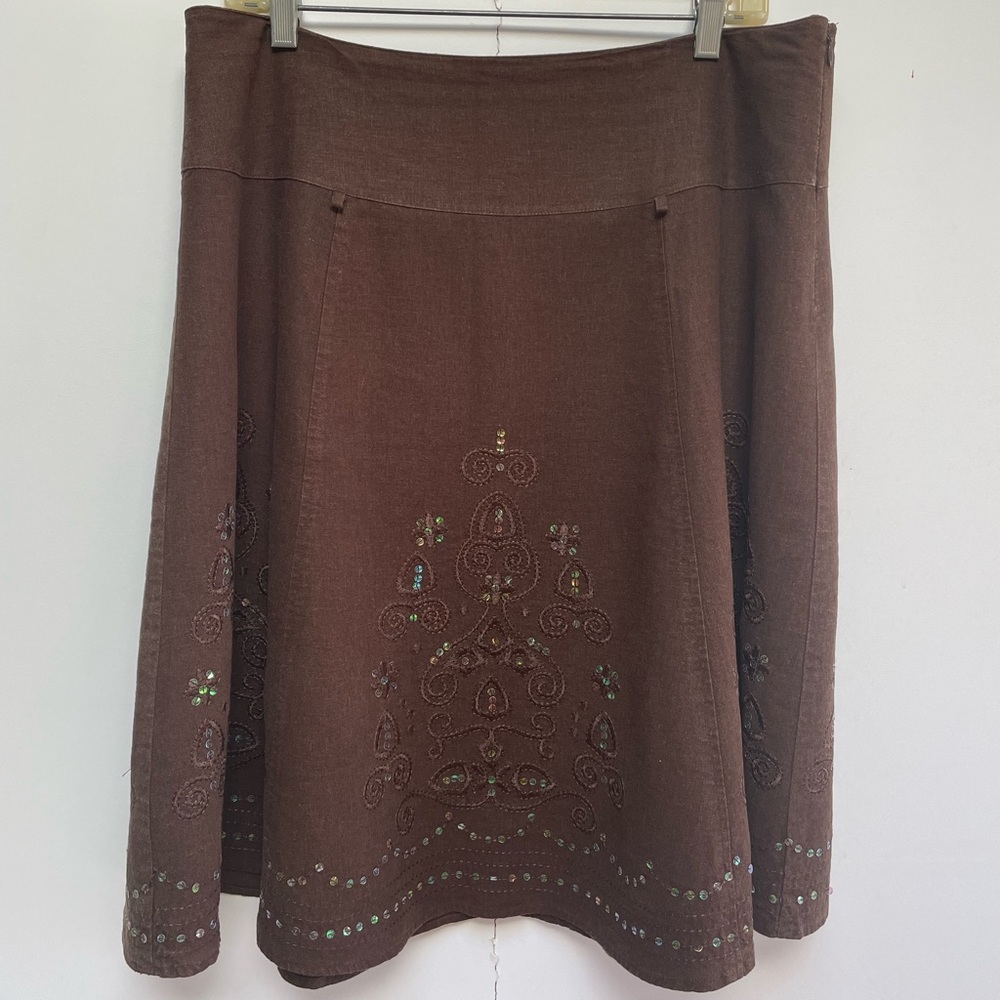 6 panel flair skirt with sequin and tone on tone embroidery embellishment.